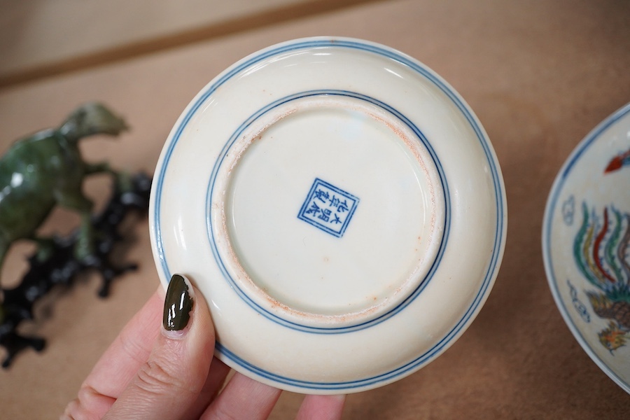 A pair of Chinese pedestal cups and three saucers. Condition - one cup severely damaged